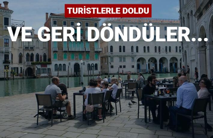 Turistler maskeli ve sosyal mesafeli
