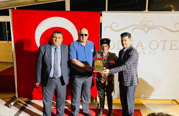 Hüseyin Aslan'a turizme katkılarından dolayı teşekkür plaketi